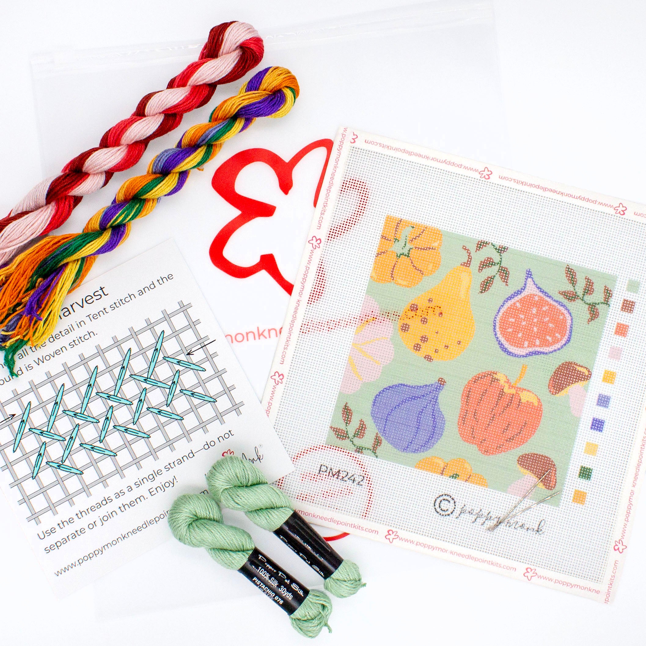 The Fall Harvest kit components on a white background. This includes the printed canvas, colorful threads, an instruction card, needles, and a plastic carrying bag with the Poppy Monk logo on it.