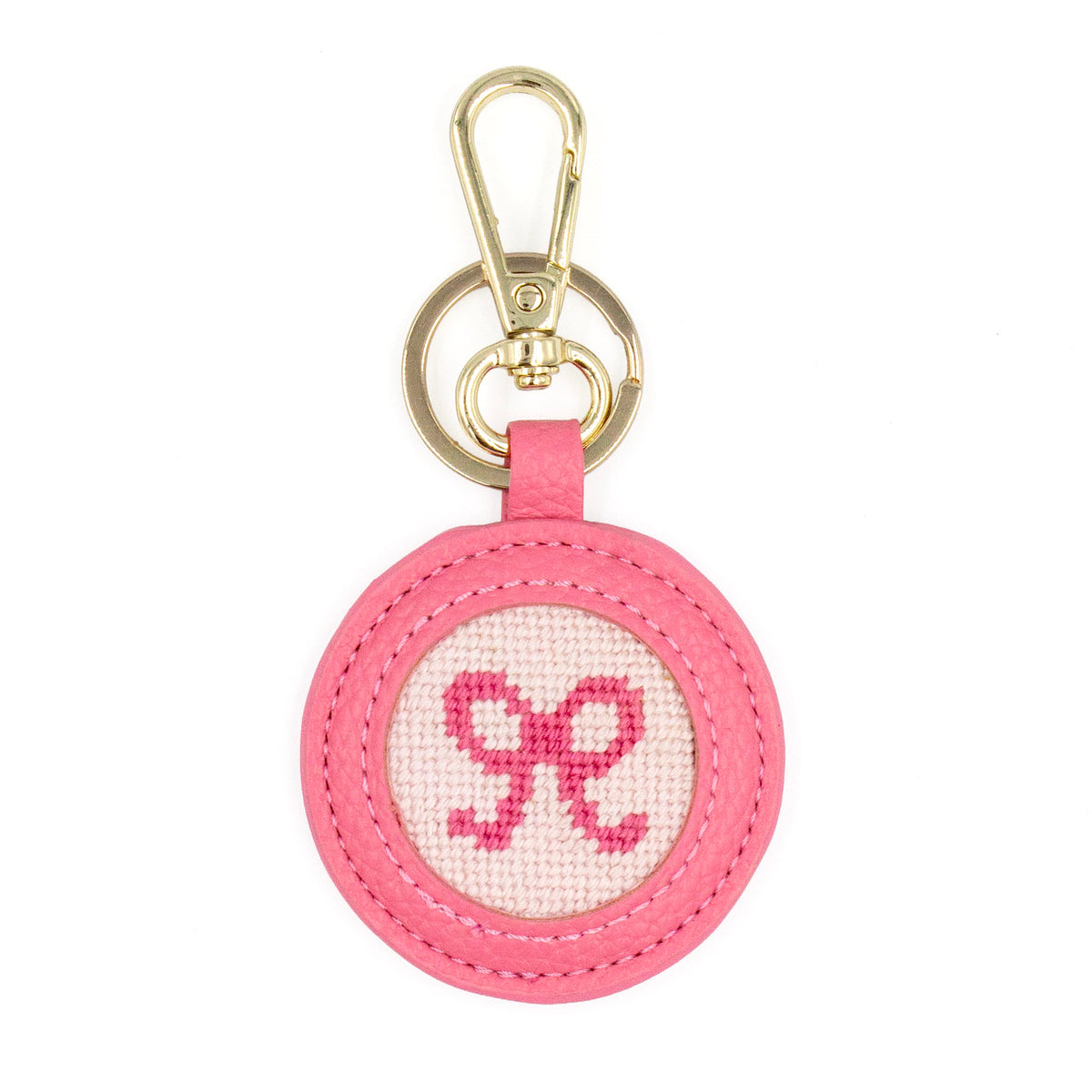 The Pink Bow design stitched and in a pink circular fob with gold key rings.