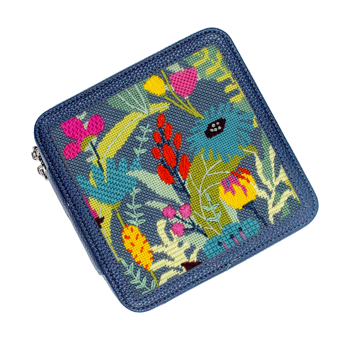 Floral needlepoint design on a navy blox lid