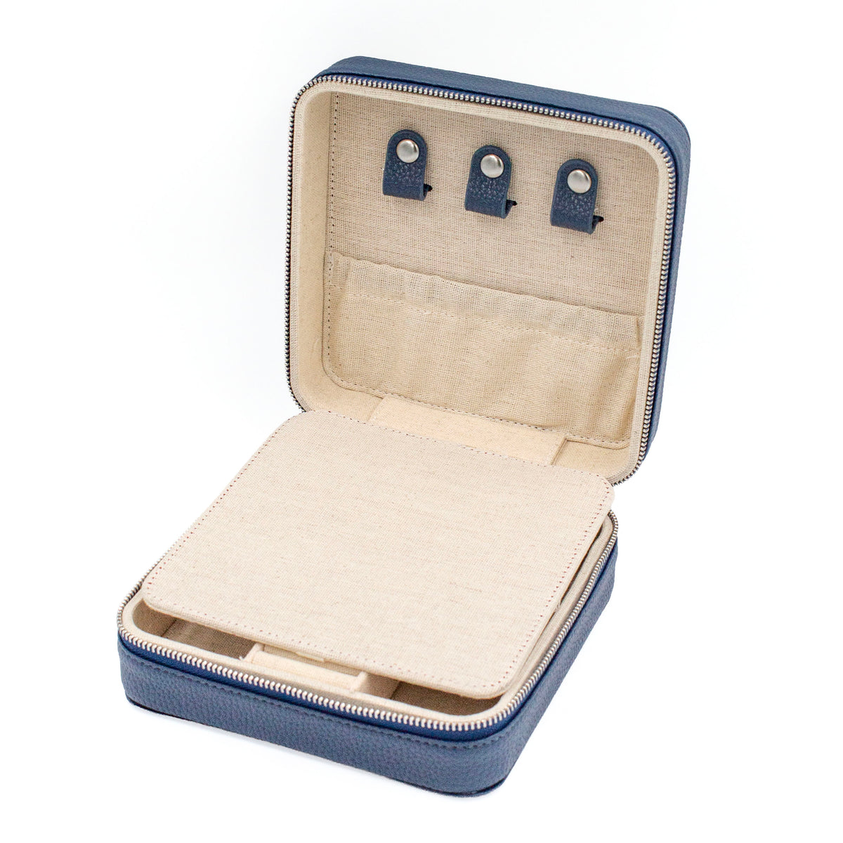 A navy blue zippered jewelry organizer case shown open, with a beige fabric interior, three small blue-and-silver clip slots at the top, and a padded insert in the lower compartment, photographed on a white background.
