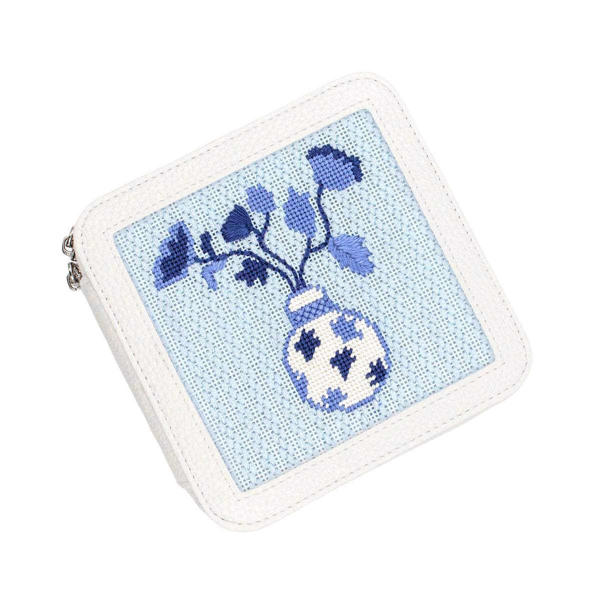 Floral needlepoint in a white box