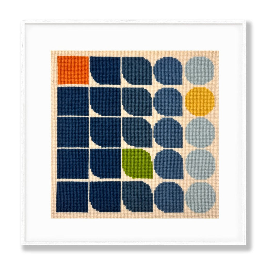 Framed abstract art print with geometric shapes in various colors on a beige background