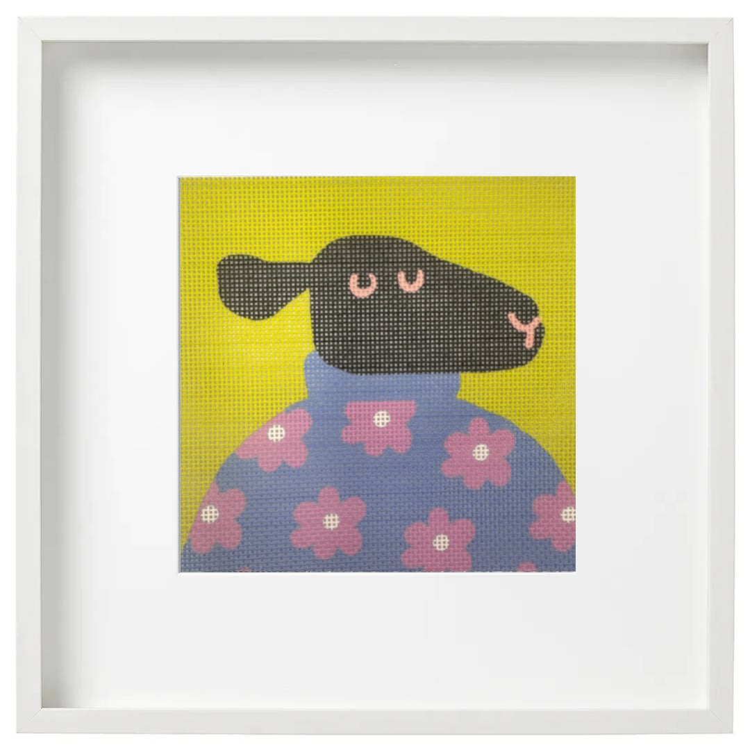 Black sheep in a sweater framed art
