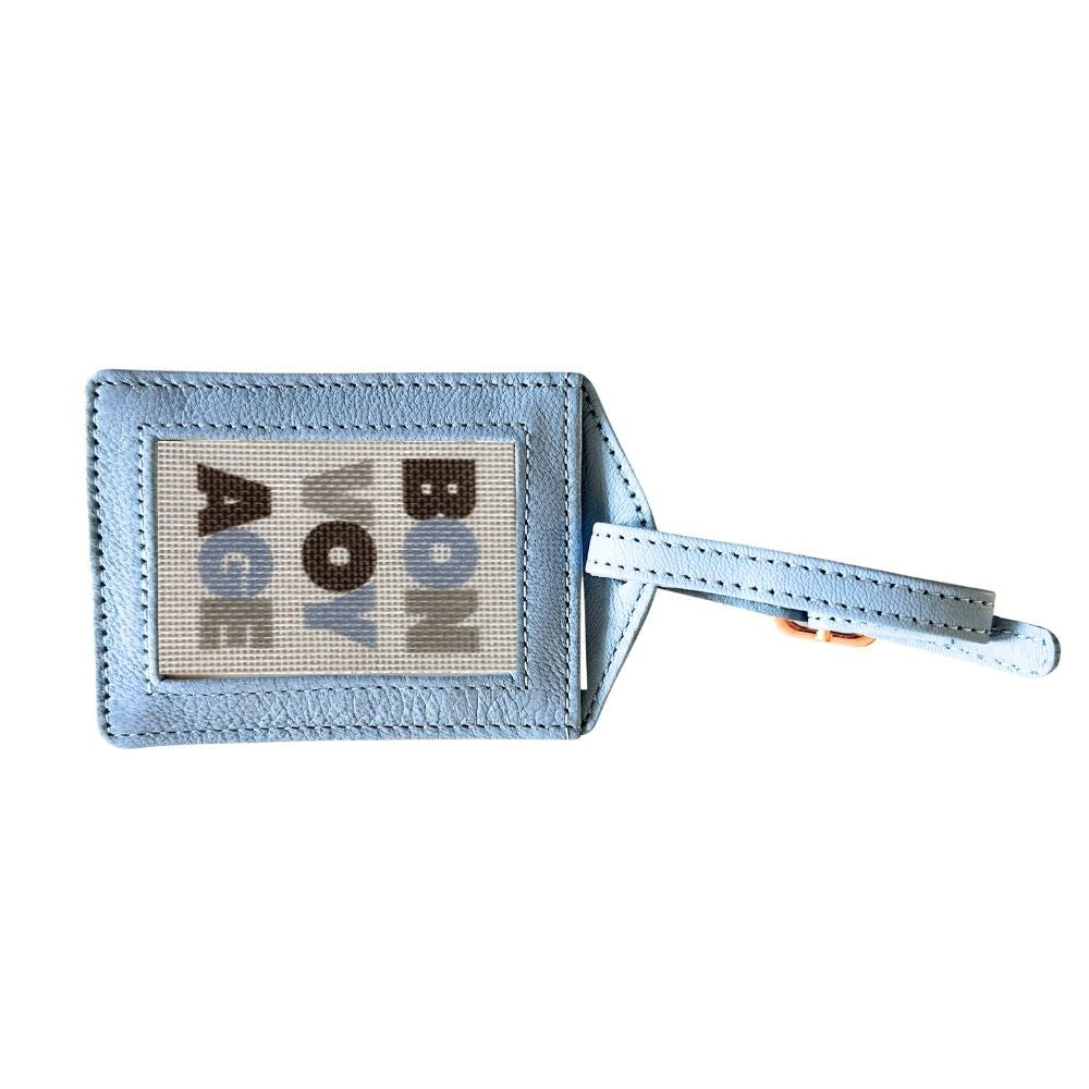 Light blue luggage tag with a needlepoint canvas