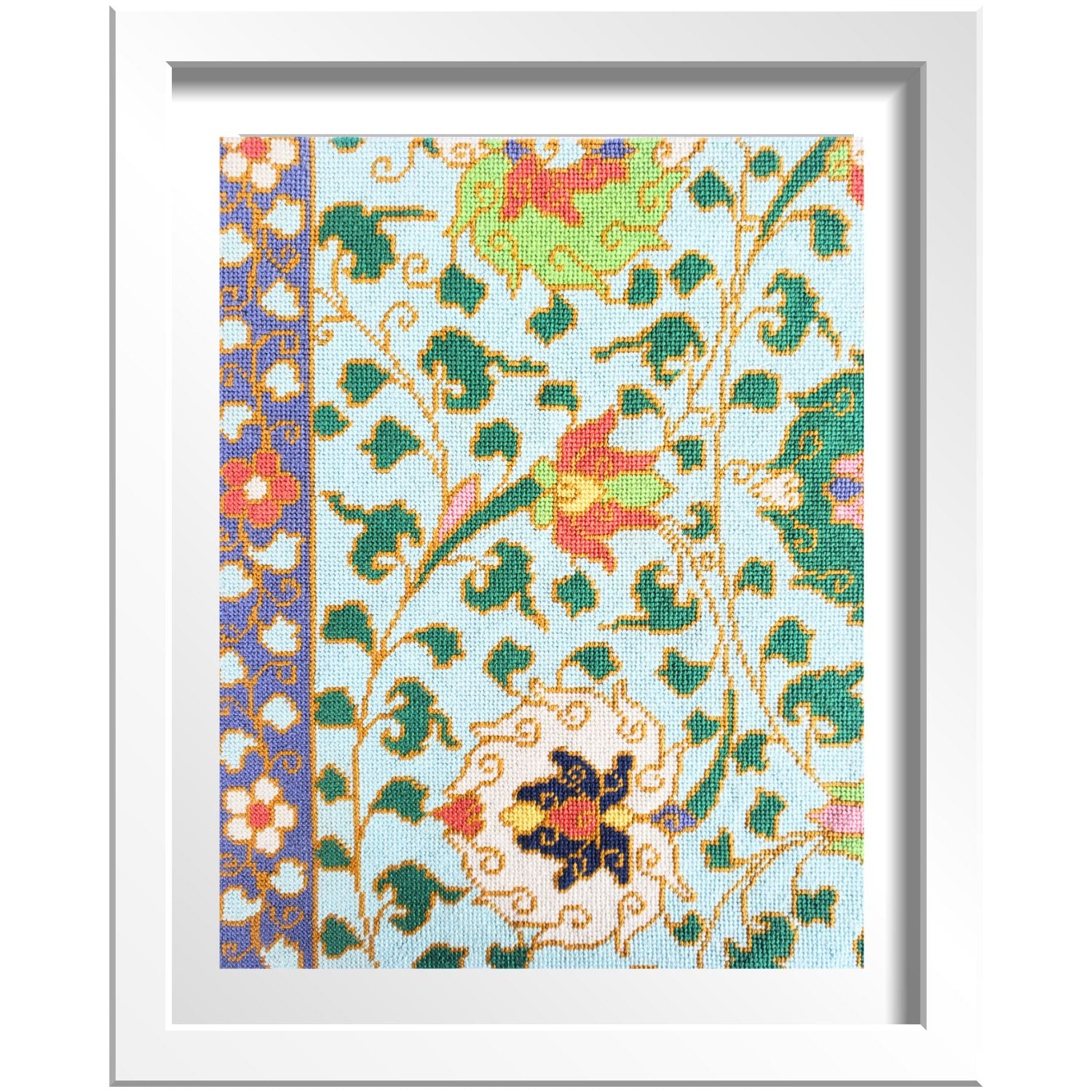 Chinese ornamental needlepoint design shown in a frame.