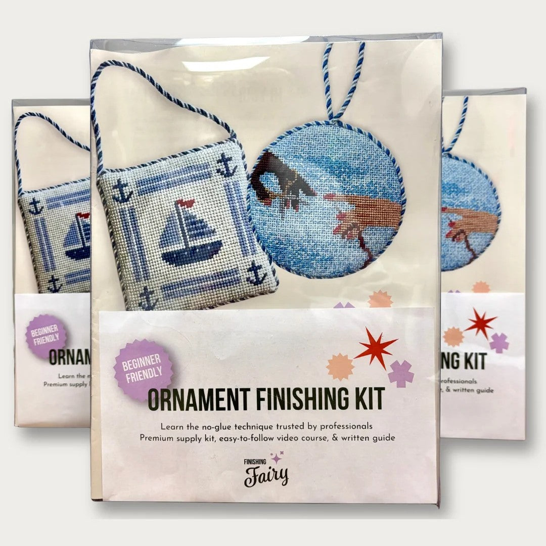 Three packaged ornament finishing kits arranged together on a light gray background. The front kit is fully visible and labeled &