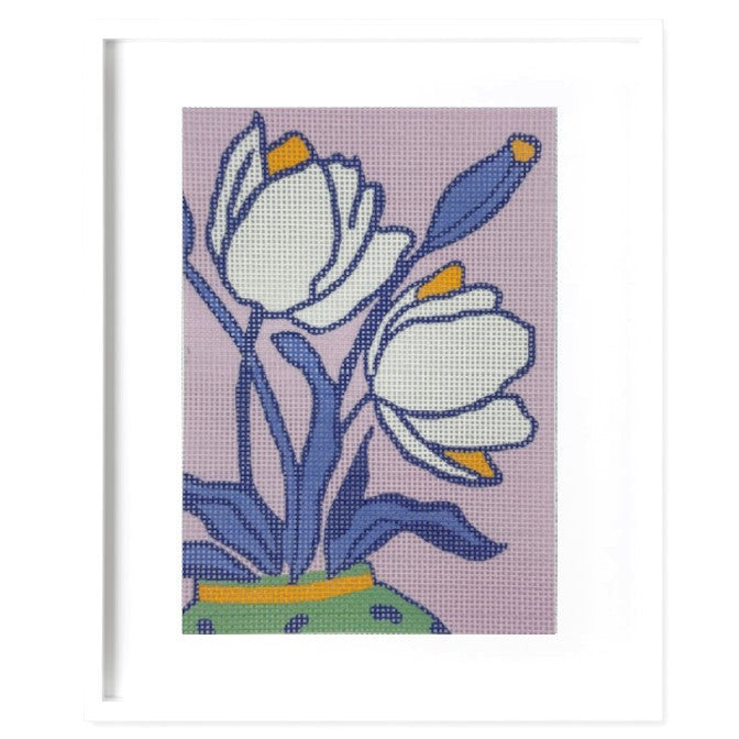Floral design with white flowers and blue leaves on a pink background