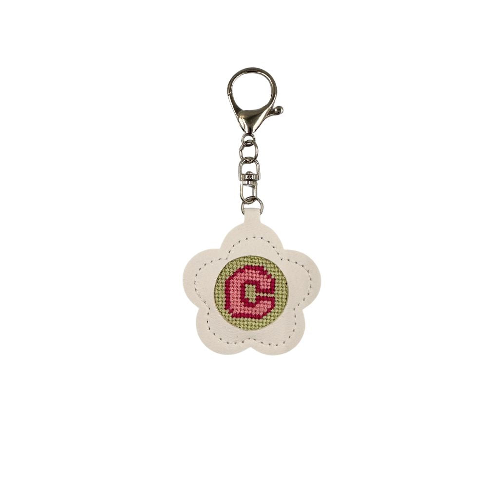 Flower-shaped keychain with a pink letter &