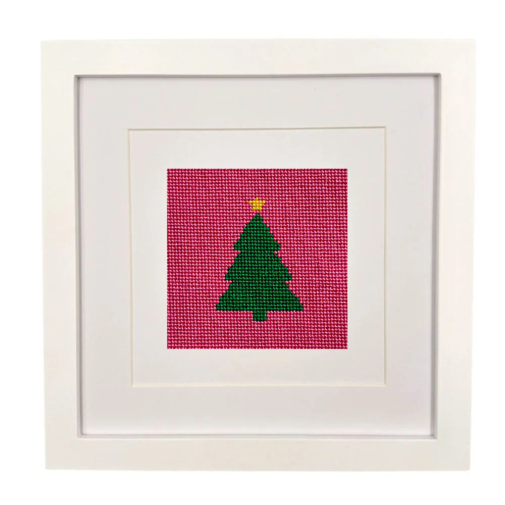 The Merry and right design stitched and it a white frame.