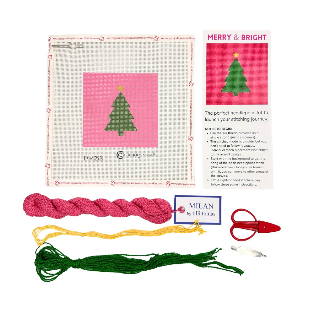 A Christmas tree needlepoint kit with threads and scissors
