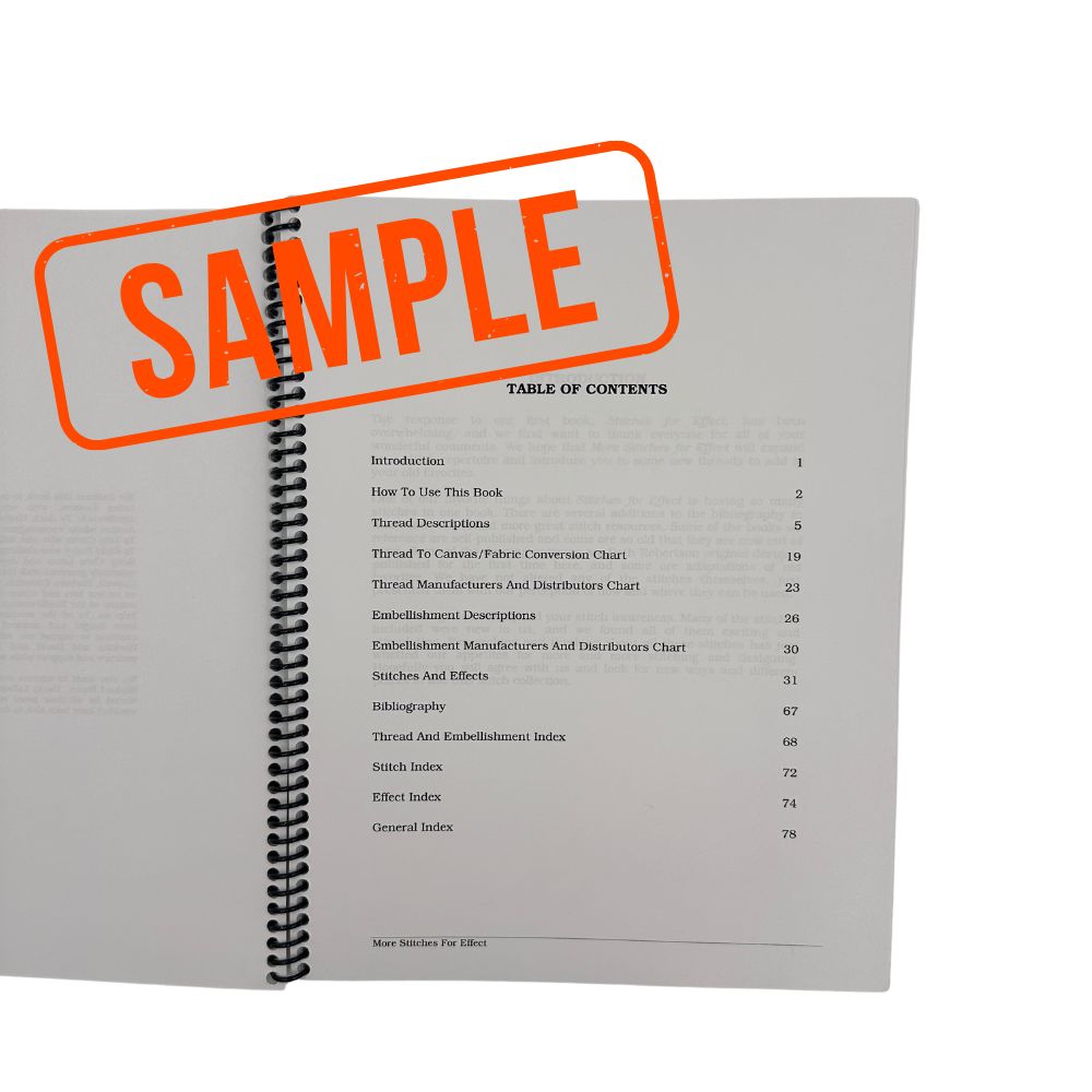 An open spiral-bound booklet or book showing a printed table of contents page, with a large orange &
