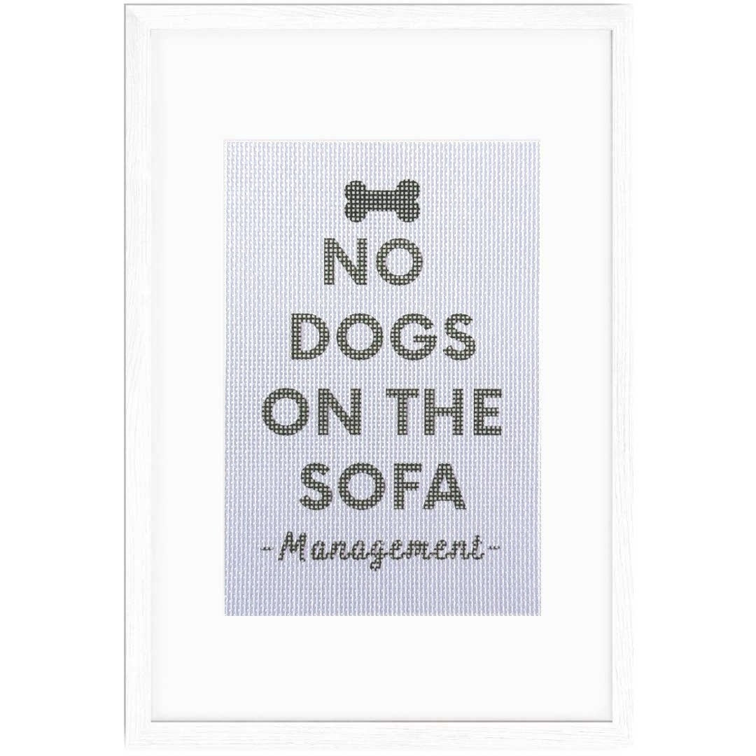 No Dogs On The Sofa sign in a frame