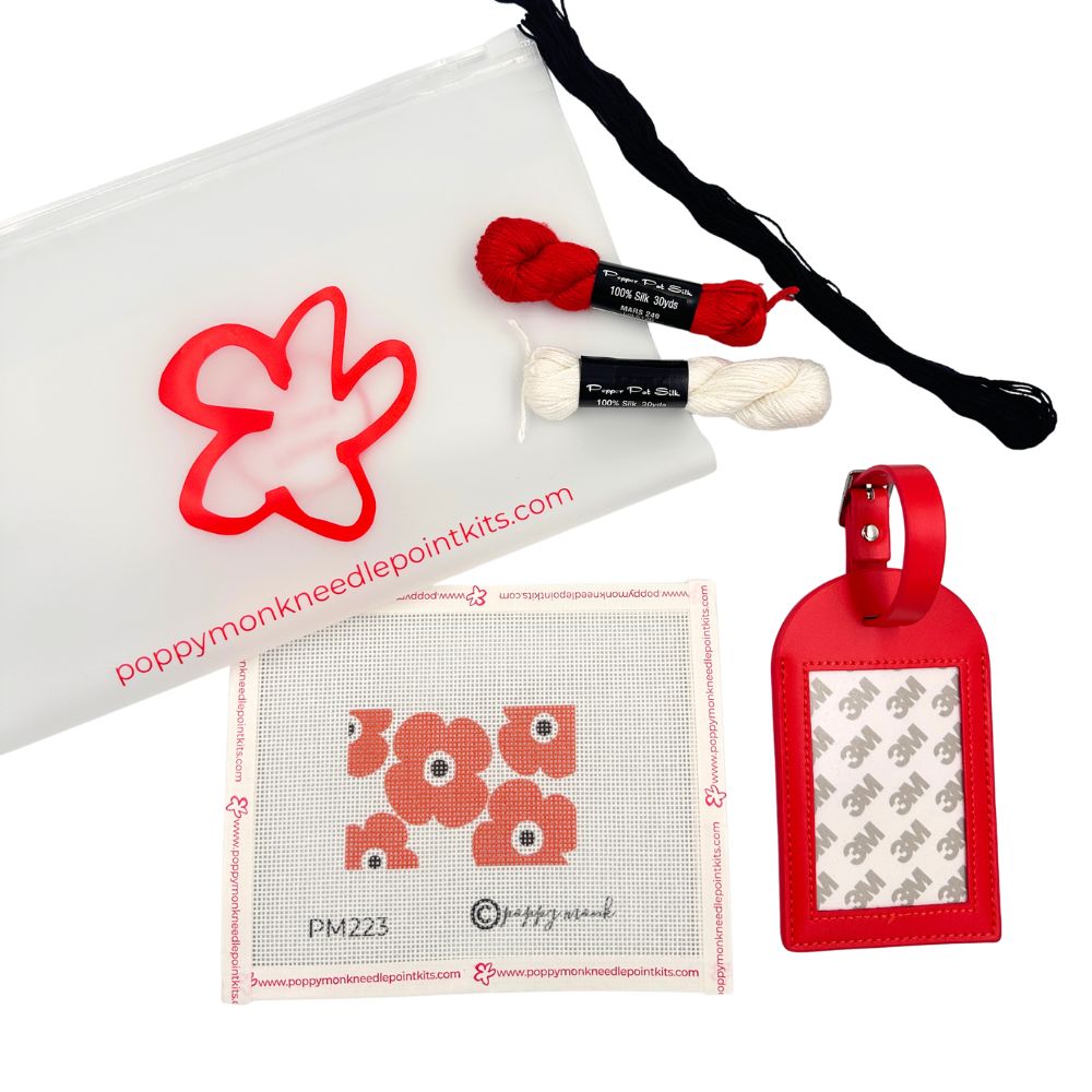 Needlepoint kit with red luggage tag and poppies design