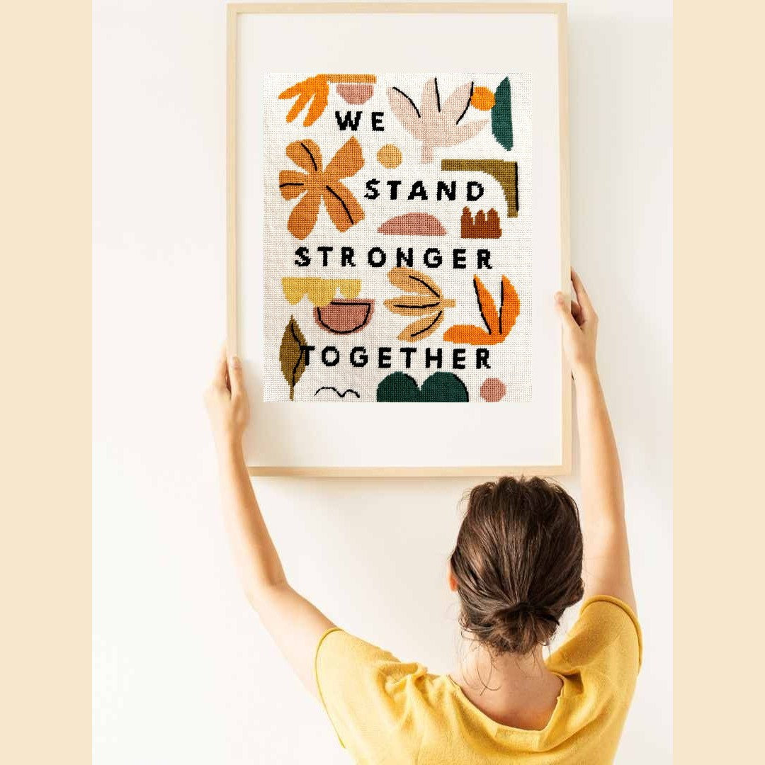 We stand stronger together needlepoint sign saying