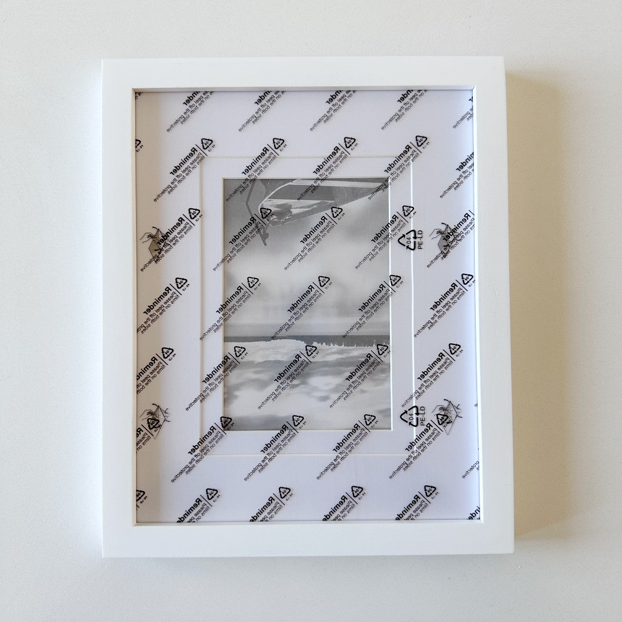 White rectangle frame with mat for 4" x 6" needlepoint canvas.