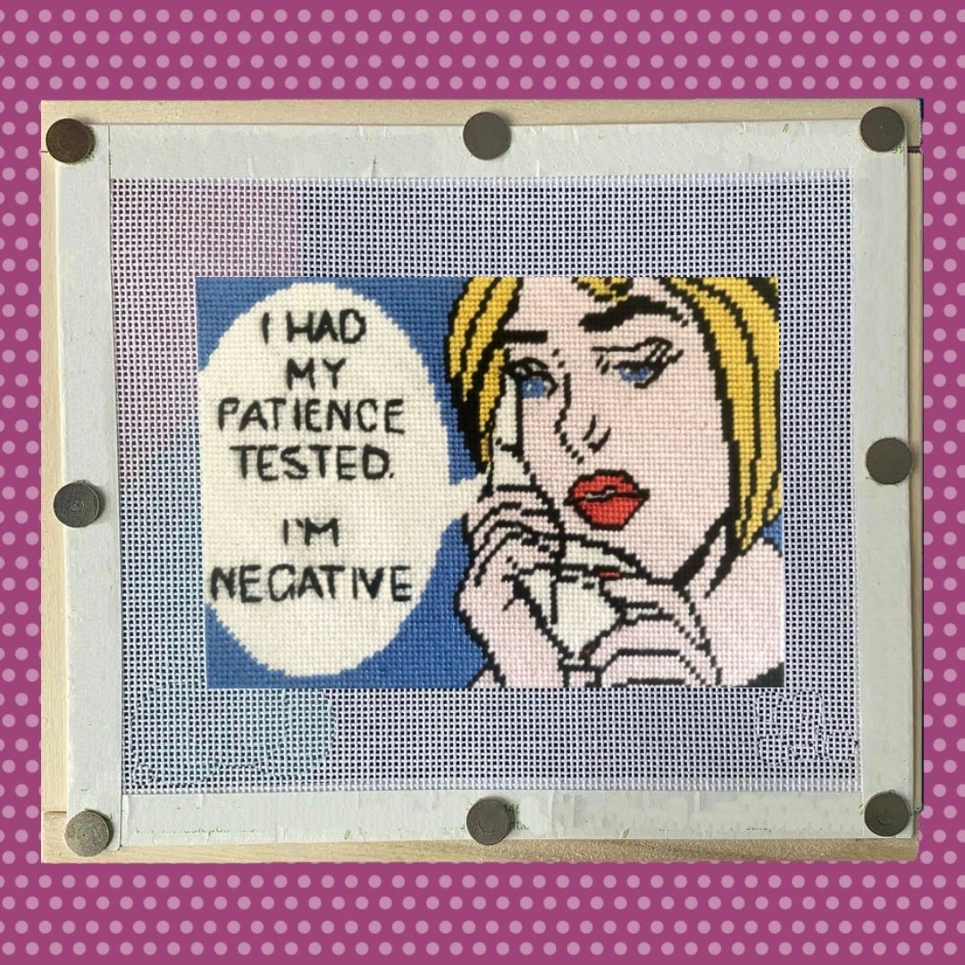 needlepoint canvas shown on stretcher bars