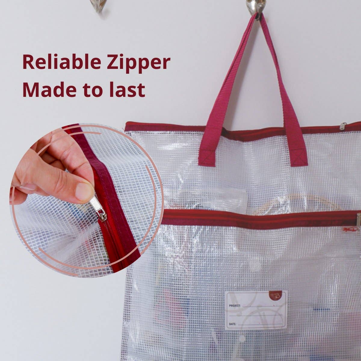 Clear mesh bag with red zipper and handles, showing a close-up of the zipper on a white background.
