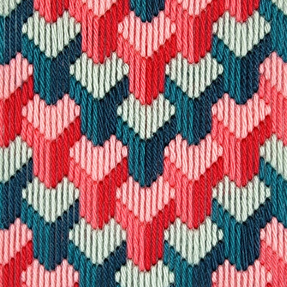 Close-up of a colorful geometric pattern with red, blue, and green hues.