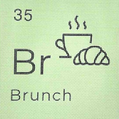 Needlepoint design of a coffee cup and croissant with &