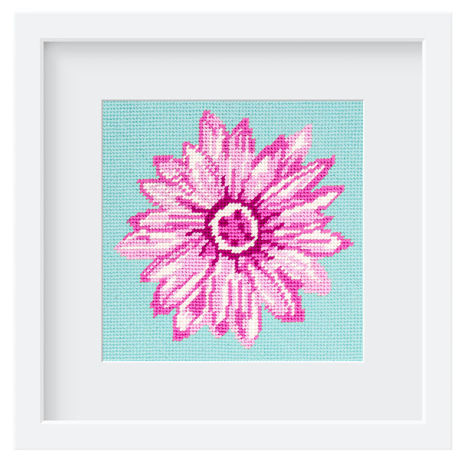 The Daisy deign stitched and in a white square frame.