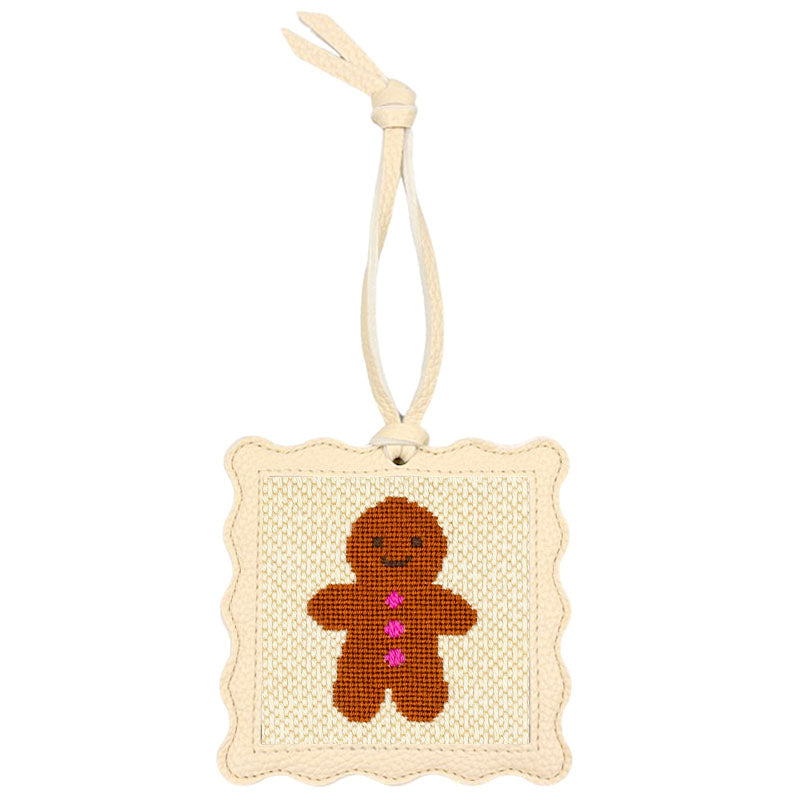 The Gingerbread design stitched and put inside the scallop-edged cream square hanger.