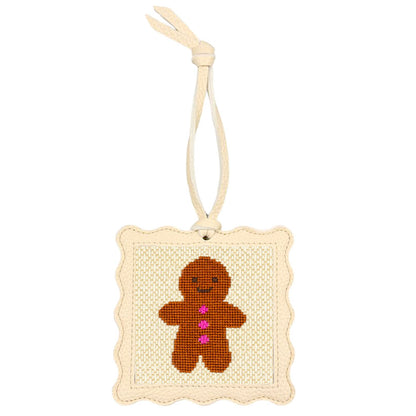 The Gingerbread design stitched and put inside the scallop-edged cream square hanger.