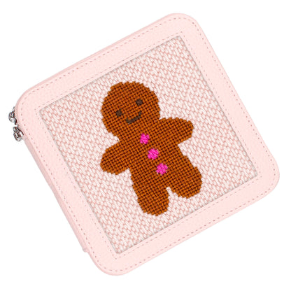The light pink jewelry box with the Gingerbread Man design on top.