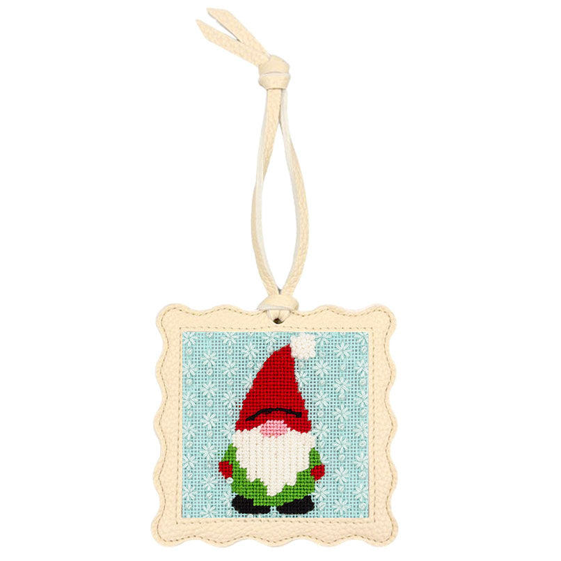 The Gnome design stitched and put inside the scallop-edged cream square hanger.