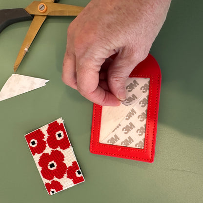 Finishing the red luggage tag