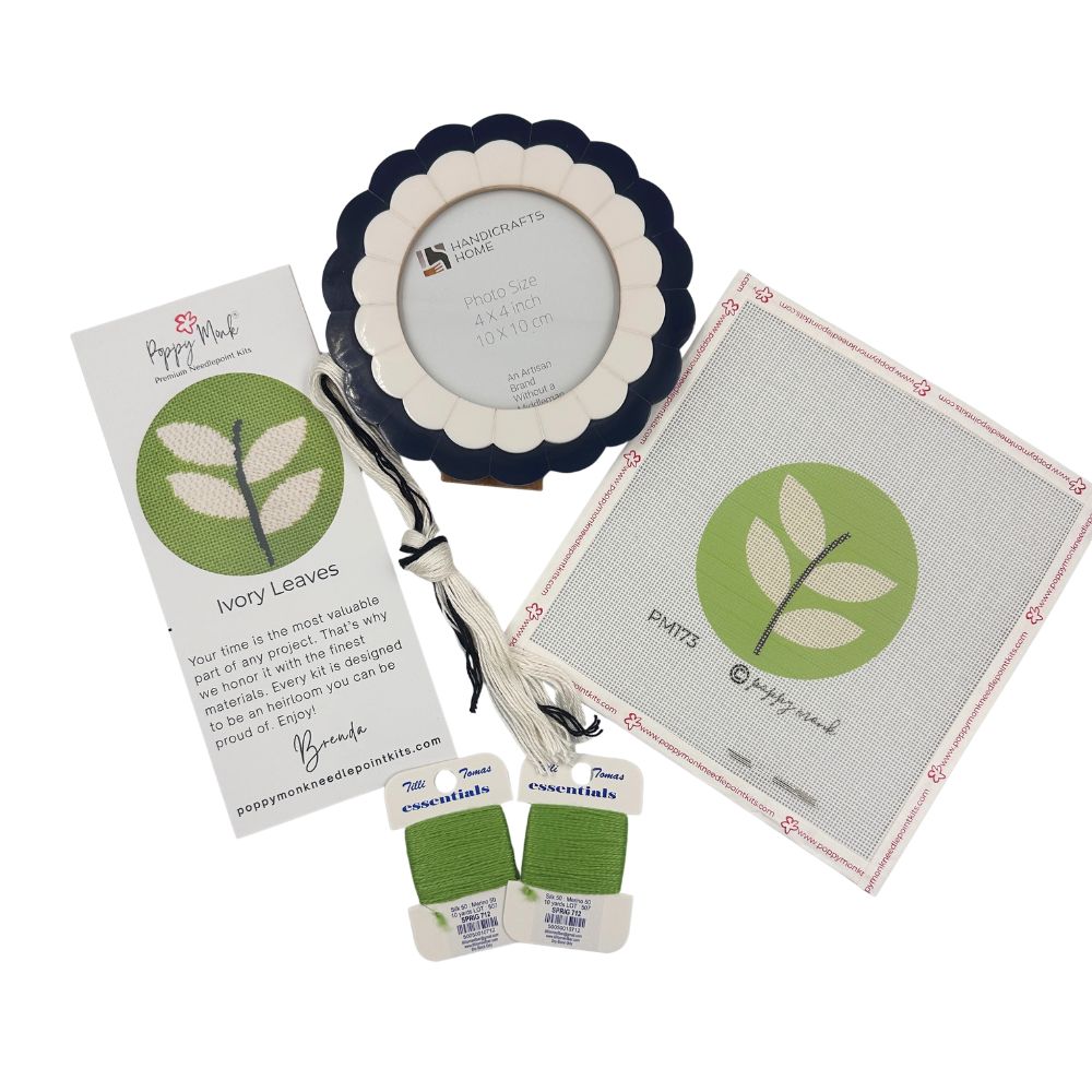 Needlepoint kit with round modern leaf design on 18 count canvas and a scalloped frame