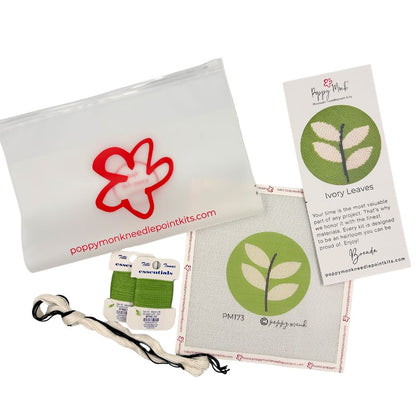 Needlepoint kit of a round design with branding on a white background