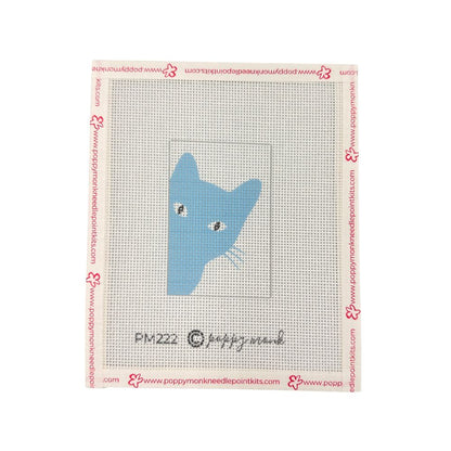 A needlepoint canvas with blue cat silhouette