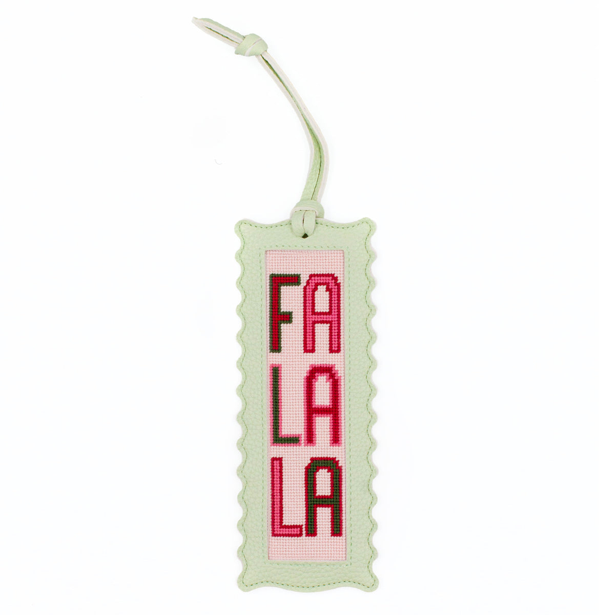 The Fa La La design stitched and finished in a pale green leather hang tag with a scalloped edge.