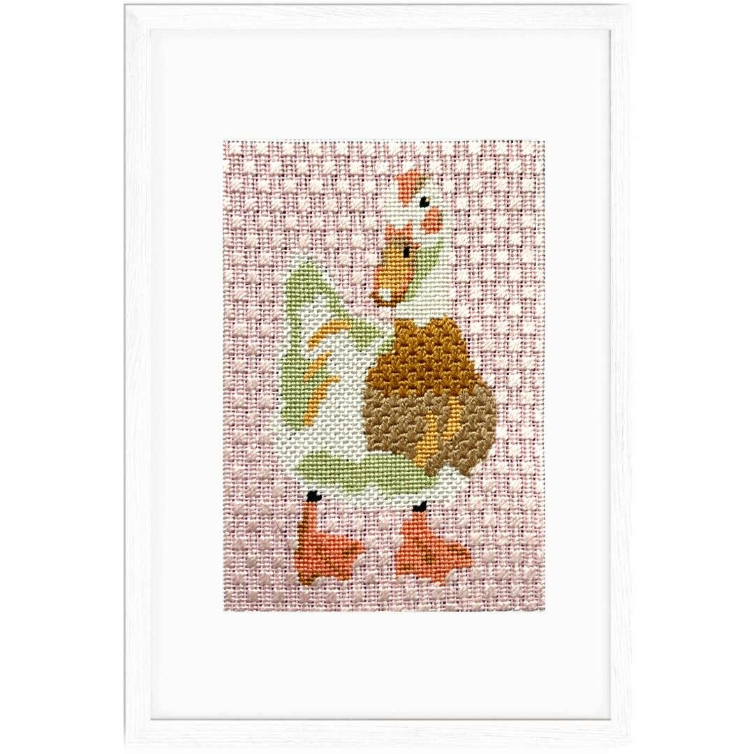Duck needlepoint shown in a frame
