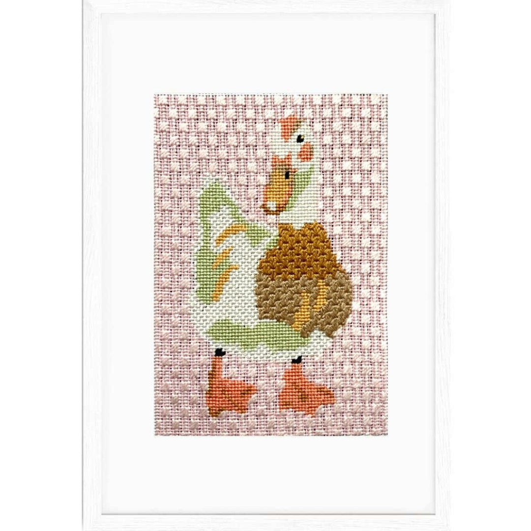 Duck needlepoint shown in a frame