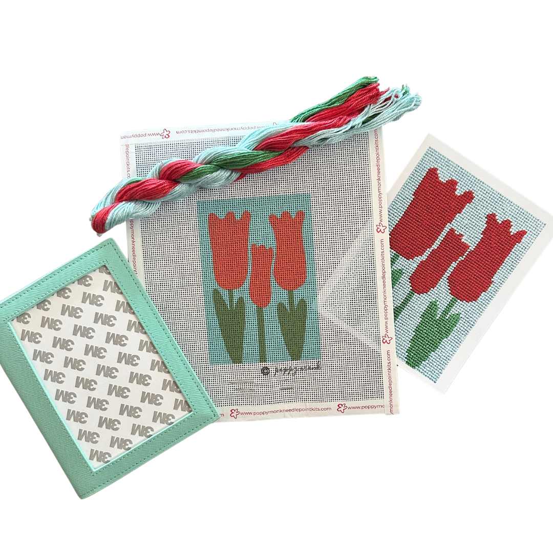 Aqua textured leather self-finishing needlepoint passport cover with Red Tulips needlepoint kit.