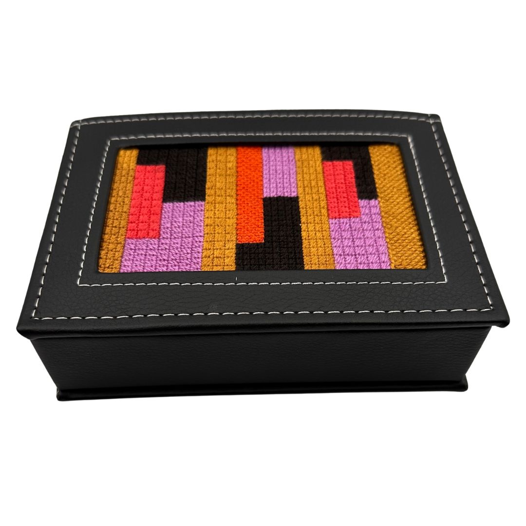 Self finishing needlepoint box kit project with abstract design and threads