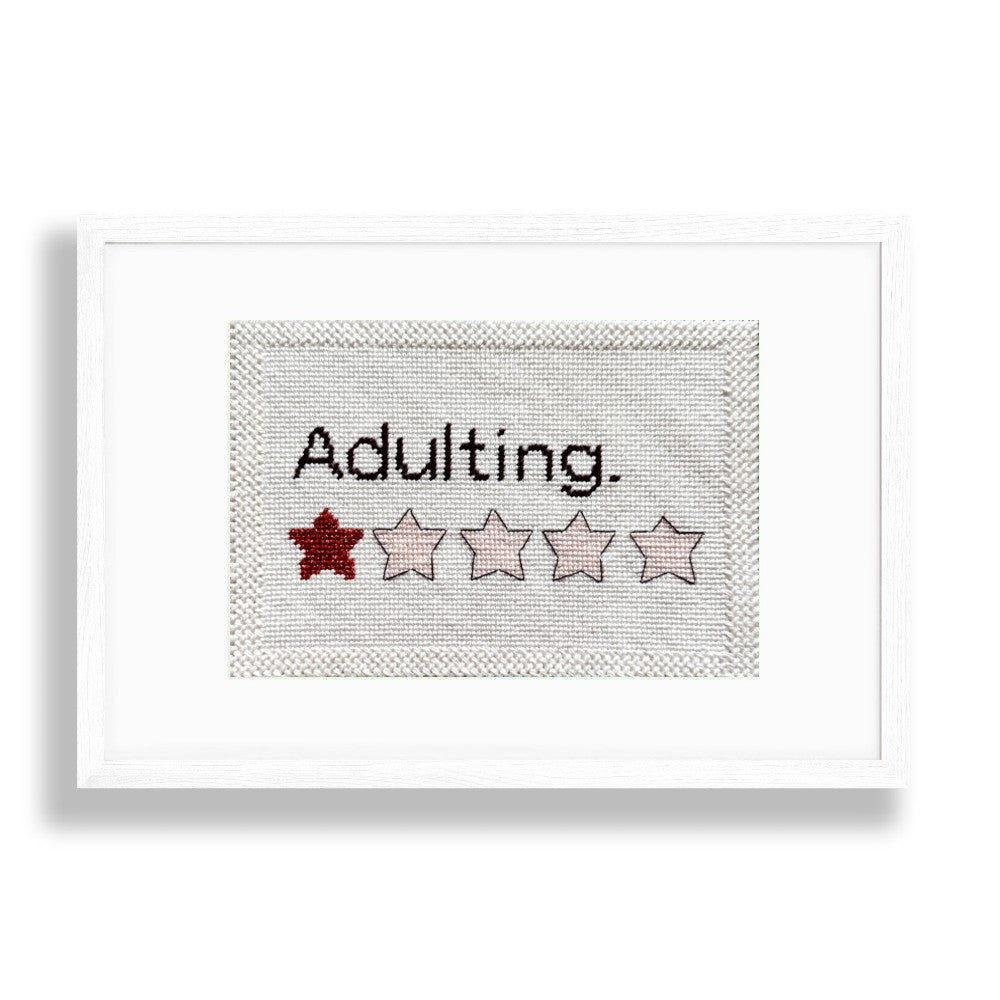 Adulting needlepoint design in a frame
