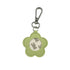 Green flower-shaped keychain with a metal clip on a white background