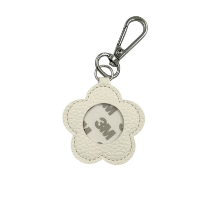 Flower-shaped keychain with a 3M logo on a white background