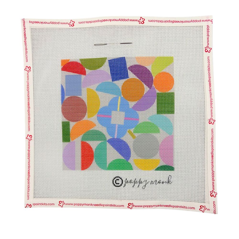 Colorful geometric pattern on a needlepoint canvas with Poppy Monk branding.
