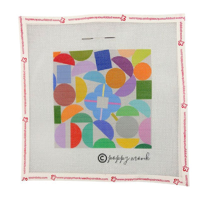 Colorful geometric pattern on a needlepoint canvas with Poppy Monk branding.