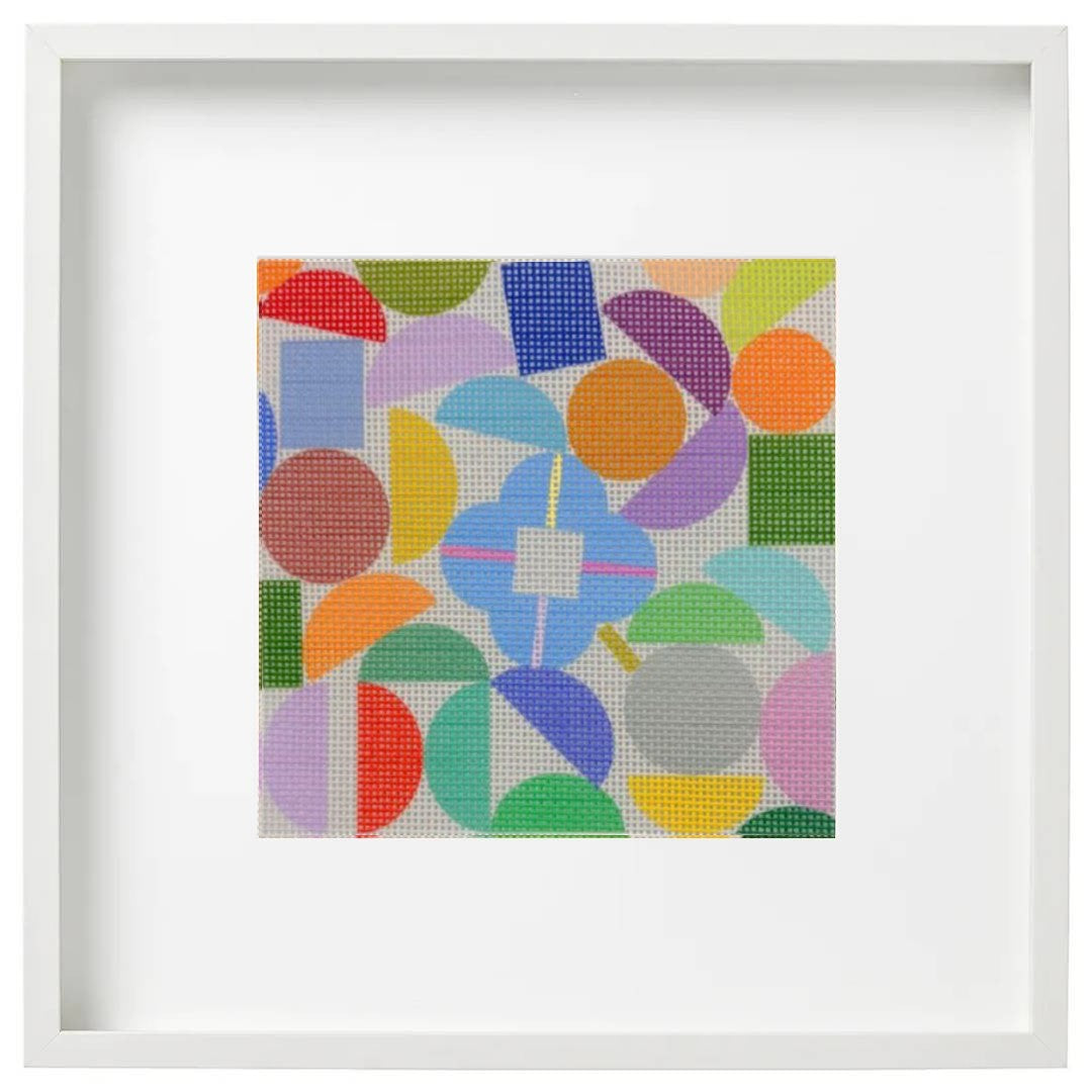 Colorful geometric patterned artwork in a white frame