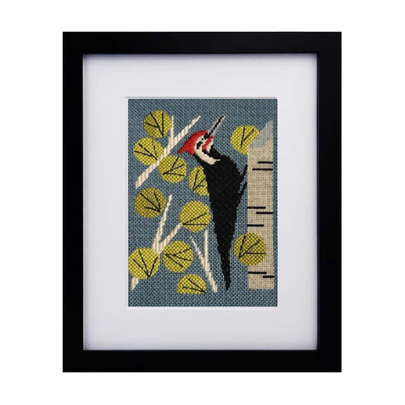 black wood frame with needlepoint bird