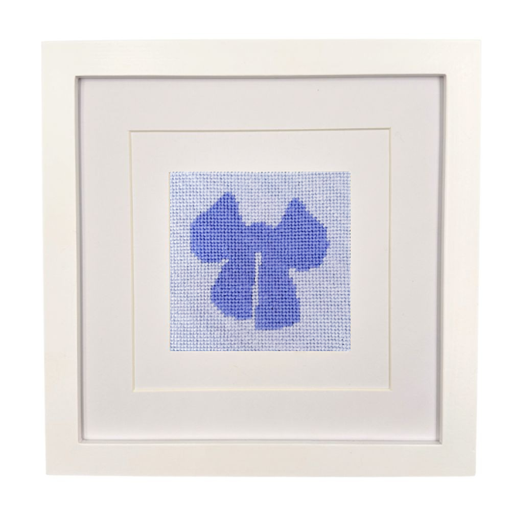 Framed needlepoint blue bow on a white background