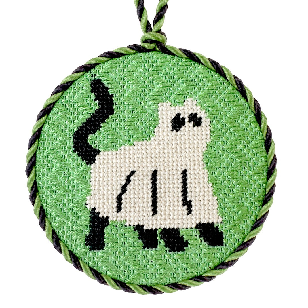 halloween needlepoint ornament of a black cat in a ghost costume