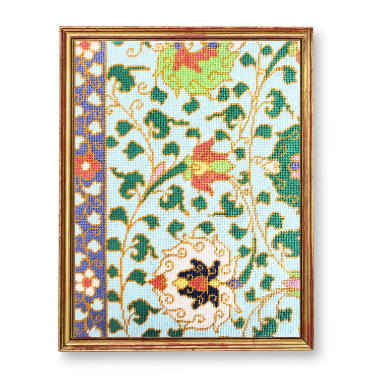 Chinese ornamental needlepoint design shown in a frame.