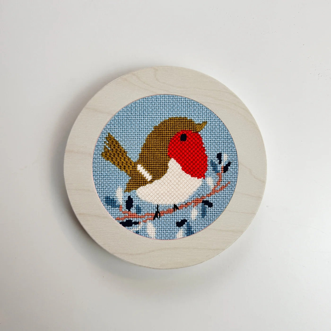 christmas robin needlepoint in a white wood holder