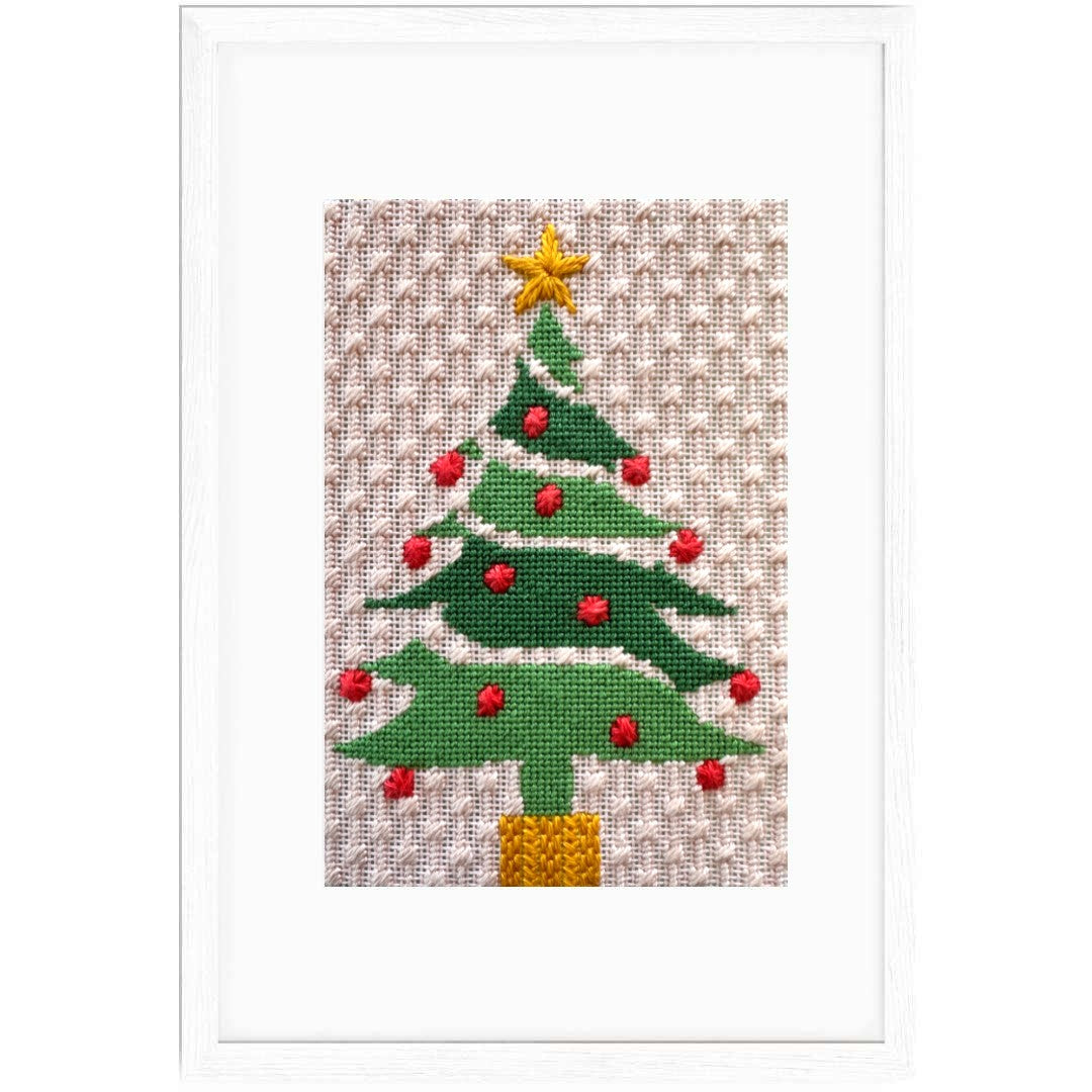 Needlepoint Christmas tree design on fabric with a star on top.