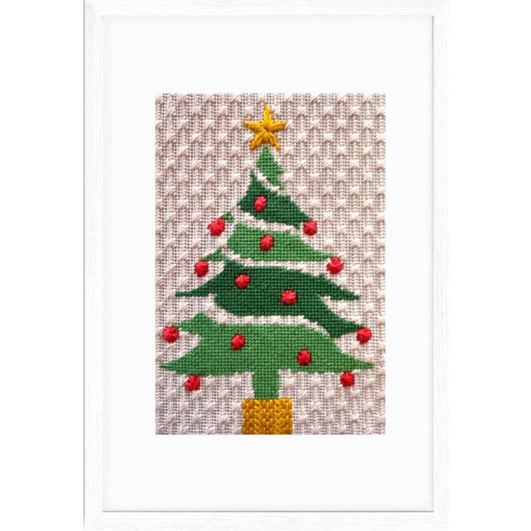 Needlepoint Christmas tree design on fabric with a star on top.
